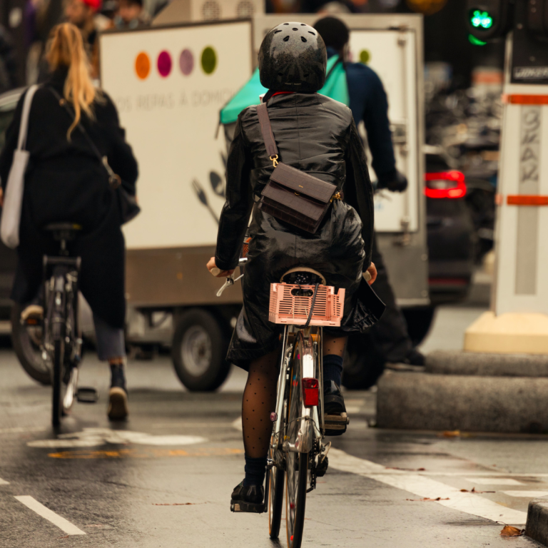 A cyclist commuting in a city bike lane